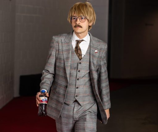 Adam Hamway - Courtesy of the NJ Devils - Adam in a Suit Holding A Soda Bottle With Silly Wig